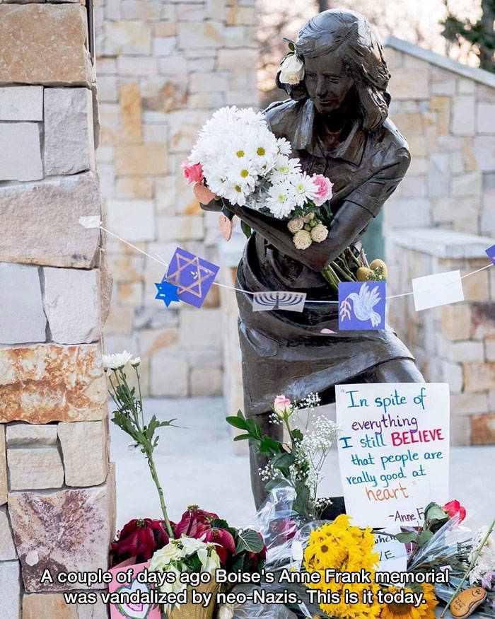 inspirational photos -- flower bouquet on anne frank statue