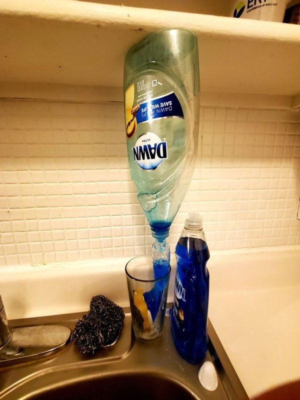 “Dish soap bottle was just the right height to lodge underneath the shelf and let the last bit fill up the scrub brush dispenser.”