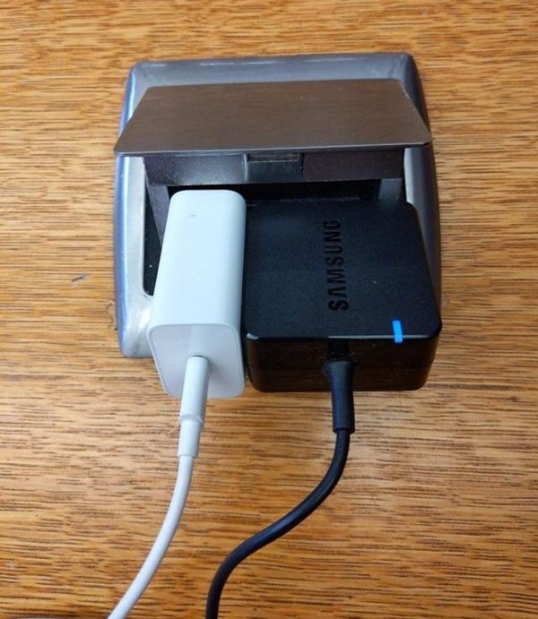 “My phone and laptop chargers fit perfectly in this desktop outlet.”