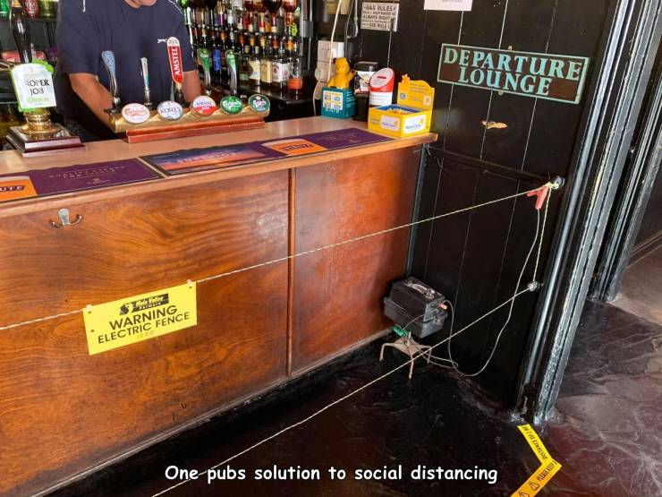 pub installs electric fence - Amstee Departure Lounge Roler NO3 Warning Electric Fence One pubs solution to social distancing