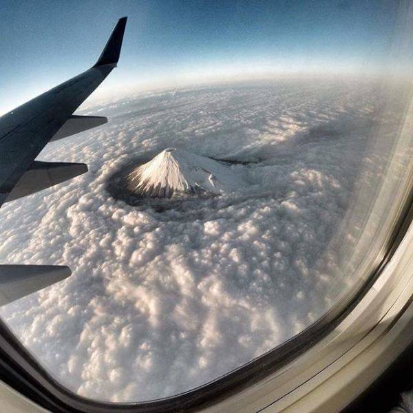 Mt. Fuji piercing through the clouds.