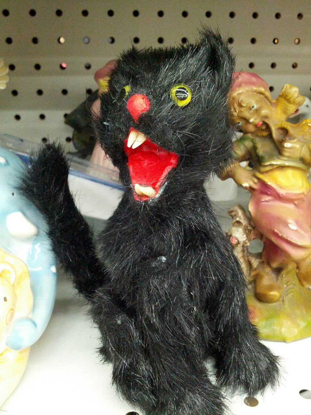 wtf images - creepy screaming black cat doll