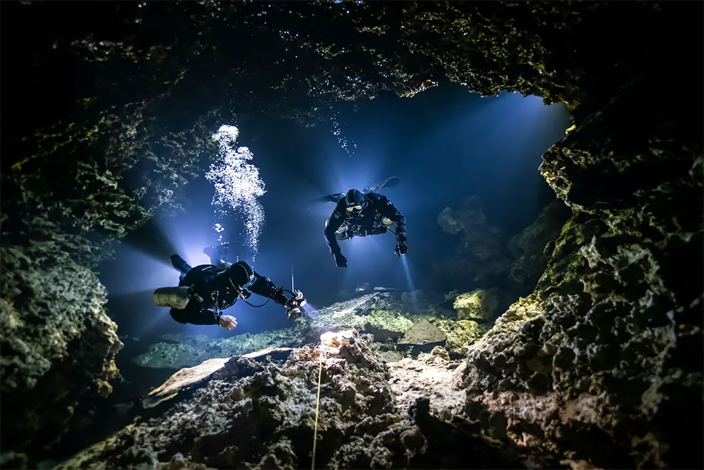 Up & coming category winner and most promising British underwater photographer 2021. Tying In by SJ Alice Bennett (Mexico), taken in Cenote Mayan Blue, Mexico.