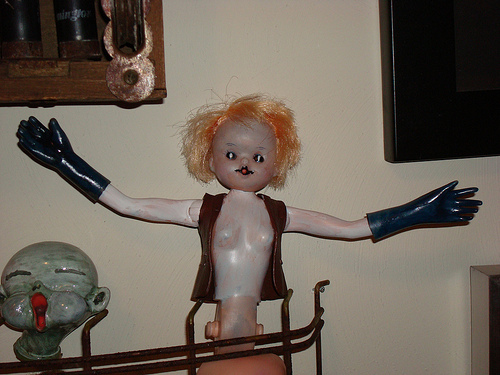 Doll With Elongated Arms And Gloves