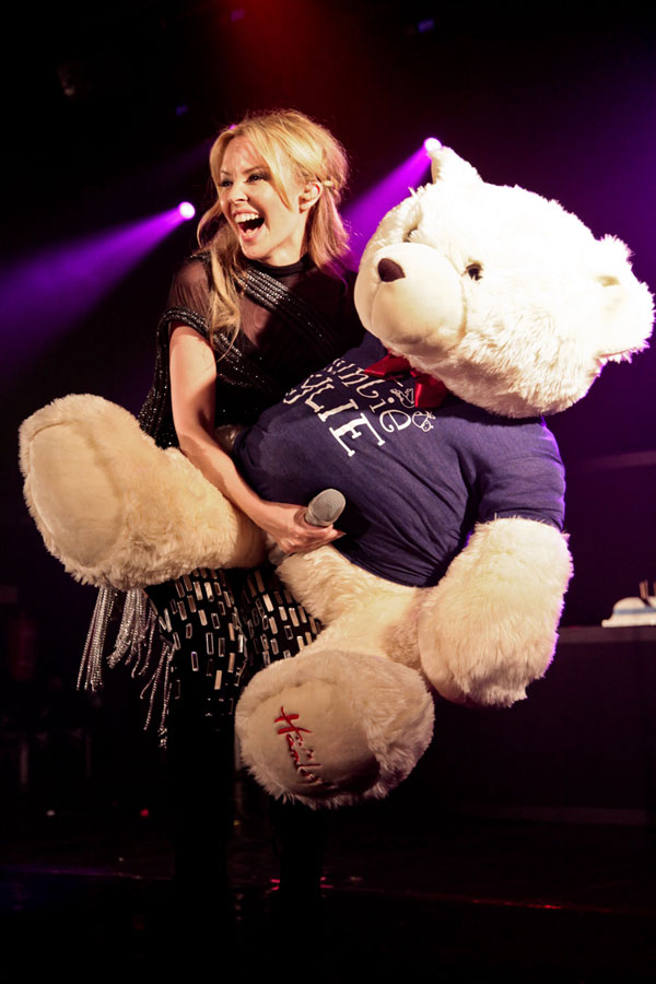 The world's luckiest bear. What is she grabbing? Oh that's the microphone