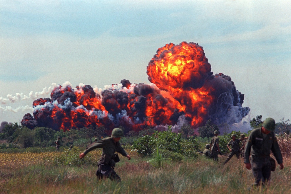 A napalm attack near U.S. troops on patrol in South Vietnam, circa 1966