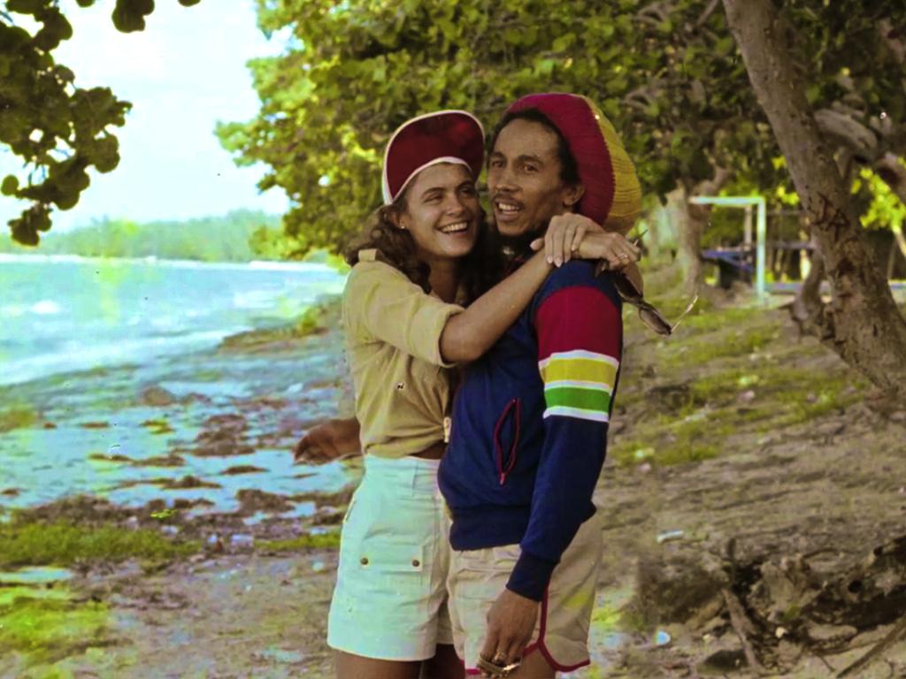 Bob Marley on the beach with Miss World 1976 Cindy Breakspeare, mother of Damien Marley