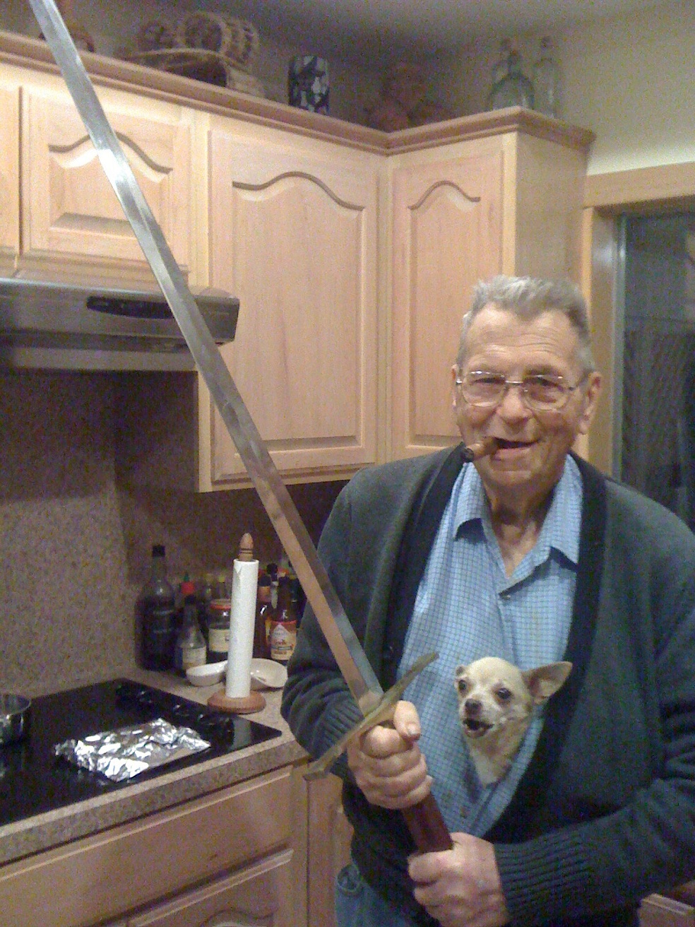 old man with sword and dog