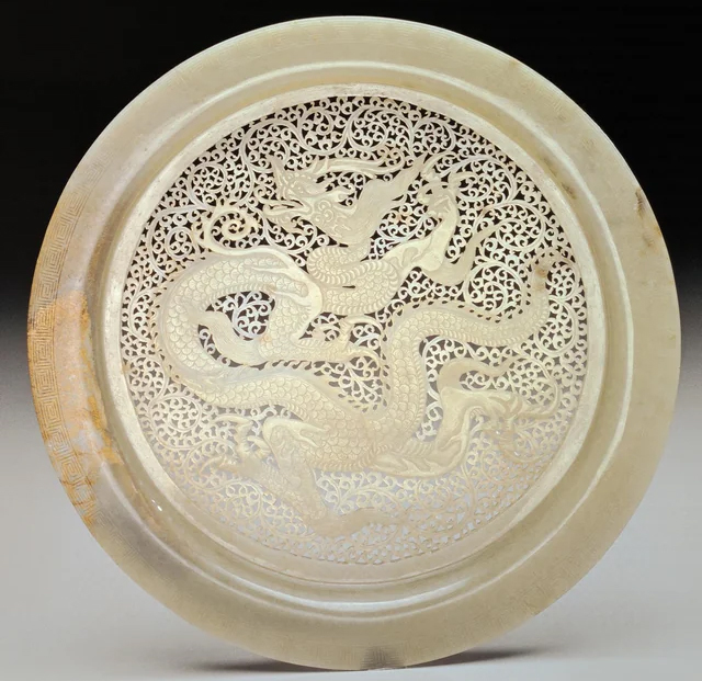 Jade Plate with dragon pattern. Song to Liao dynasties (960-1279 CE). Now housed at the Palace Museum in Beijing, China.