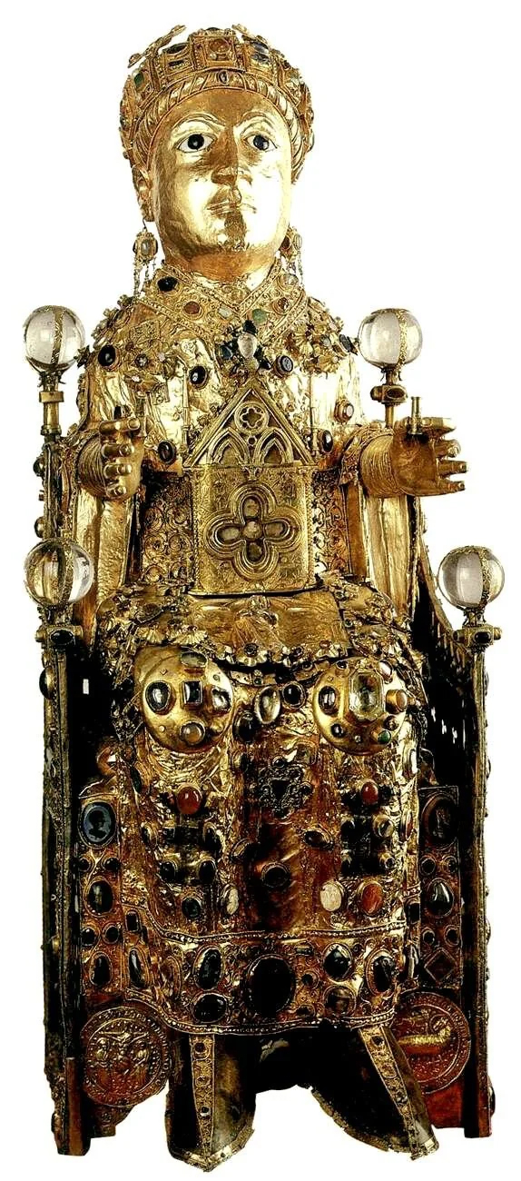 Golden reliquary statue containing the remains of the 2nd century child saint Sainte Foy (Conques, France). Late 10th to early 11th century with later additions, but also incorporating a late-Roman golden mask.