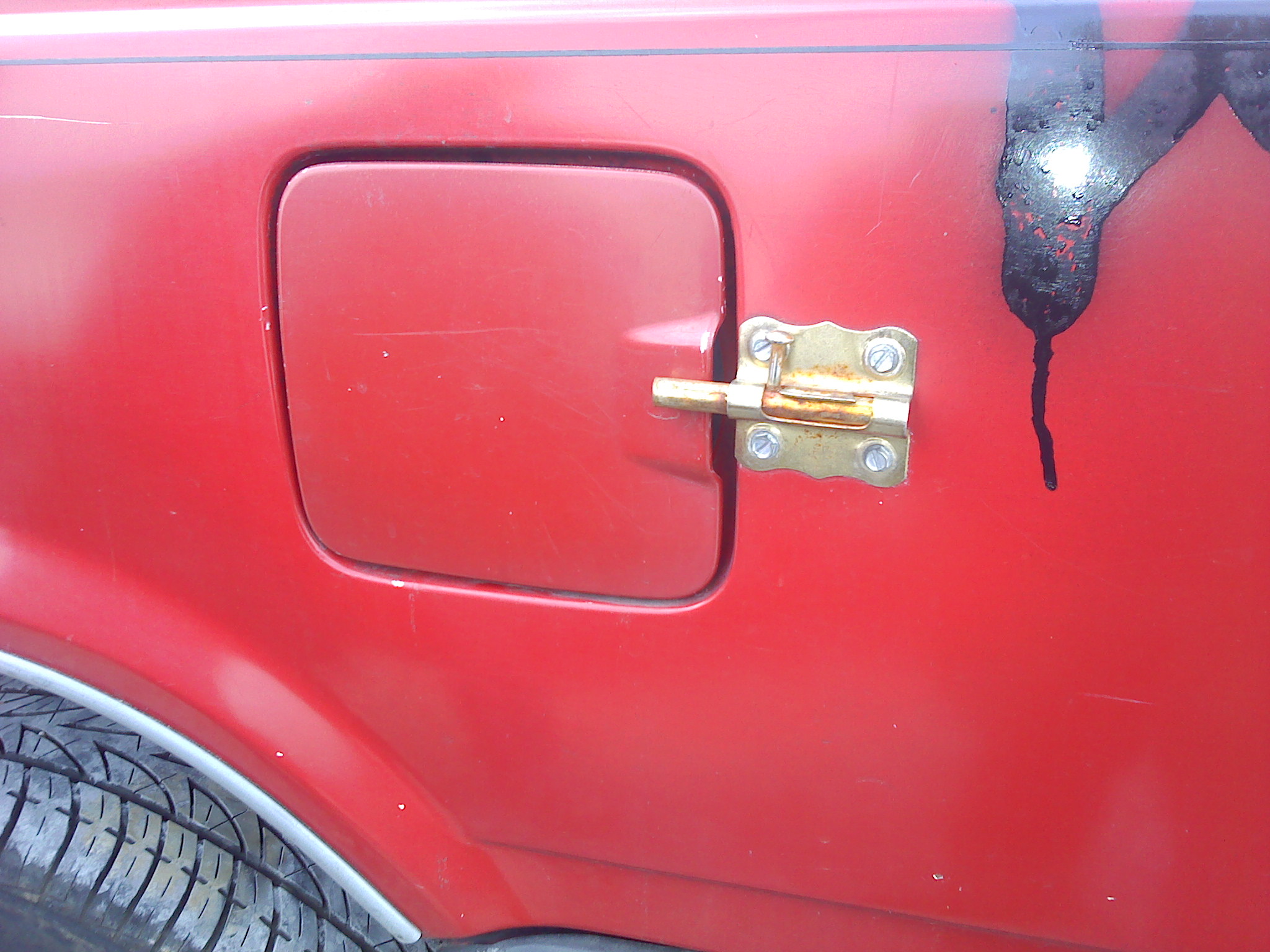 Gas door lock