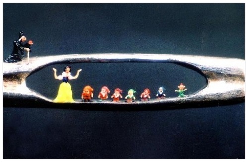 Snow White and the Seven Dwarfs (note the witch with the apple,above the eye of the needle)