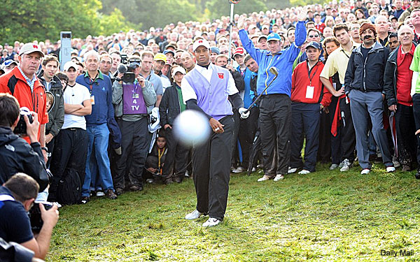 The photo from the weekend's Ryder Cup action. No, it's not staged or Photoshopped. That's really Tiger Woods hitting a golf ball straight at the camera.

How'd it happen? By mistake. The cameraman, Mark Pain of the Daily Mail, was in the proper position on the 18th hole when Woods flat-out duffed his shot. The ball hit Pain's camera and dropped 