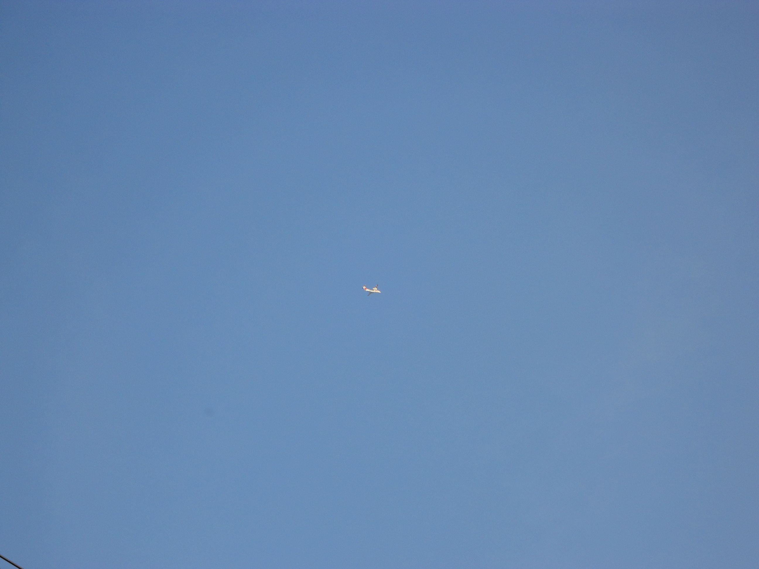 Airplane is Flying up in the Sky during Very Beautiful and Sunny Weather.