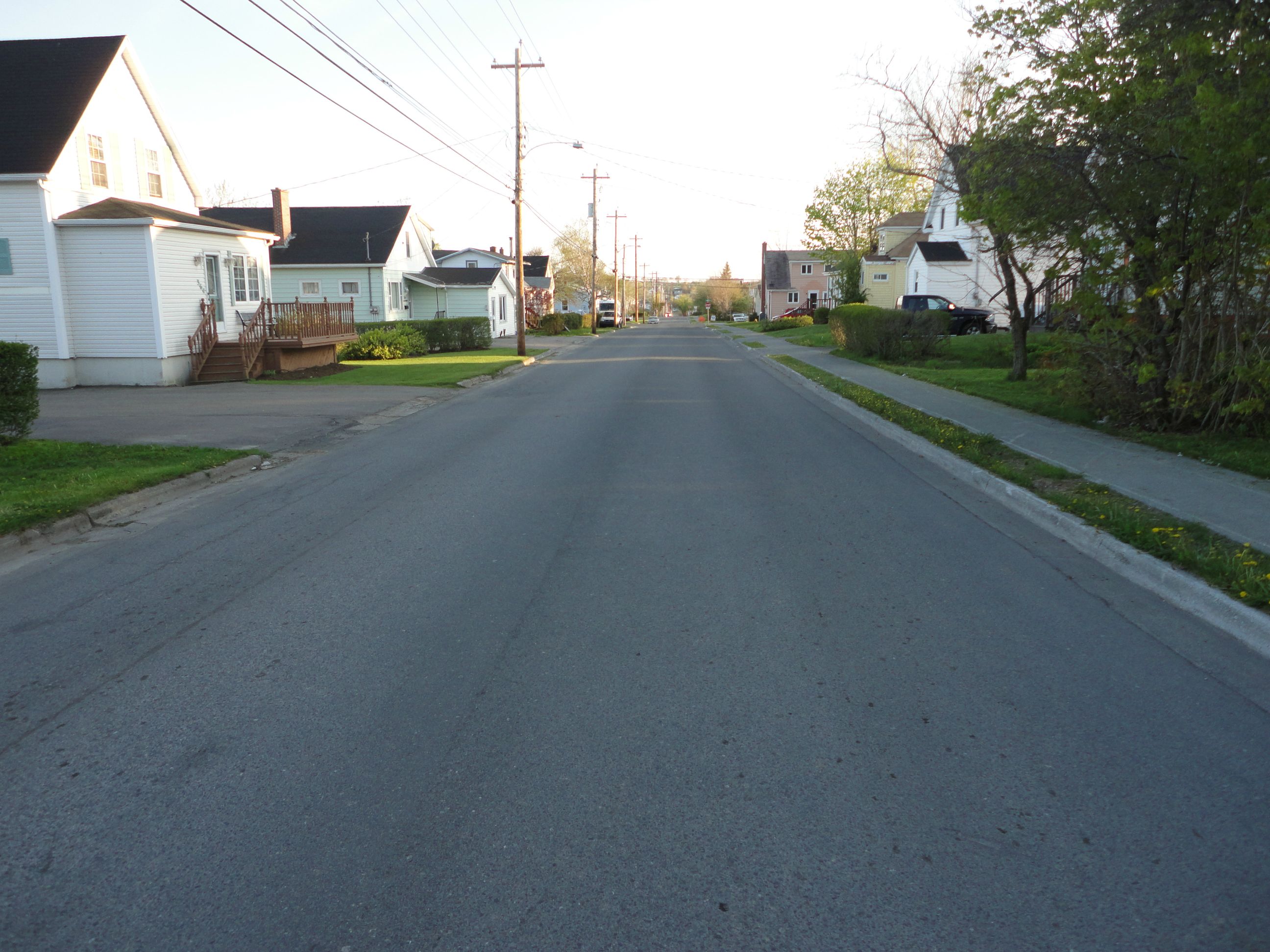 Cabot Street is Heading towards Cottage Road and the Grass is Green in late spring.