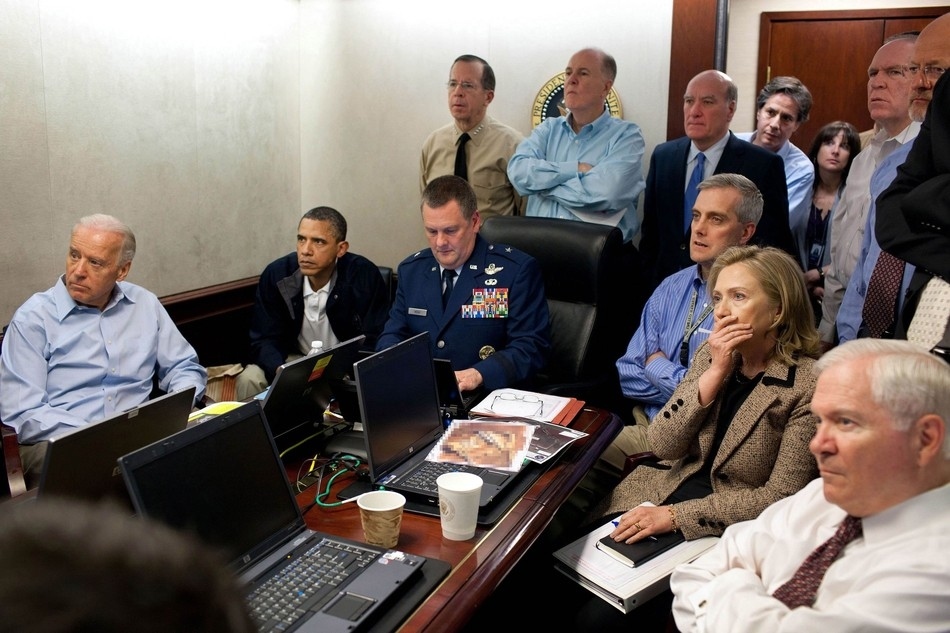 Members of the national security team receive an update on the mission against Osama bin Laden in the Situation Room of the White House on May 1
