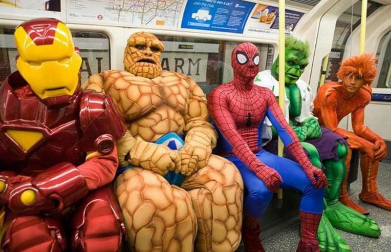 Costumed heroes riding the subway