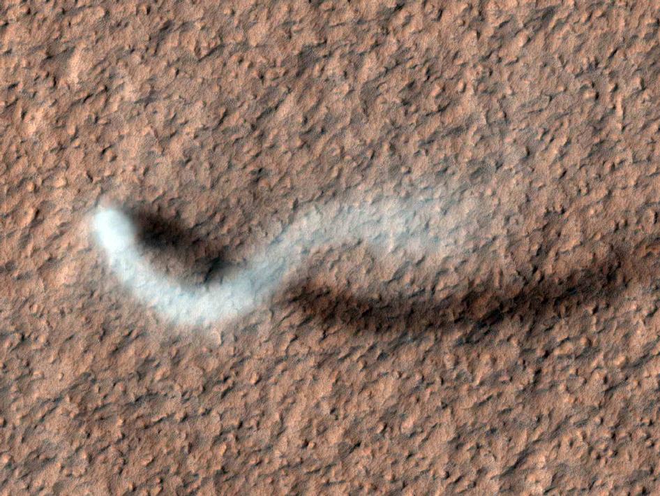 Hi Res photo of an 800m high dust devil traveling across the martian surface.