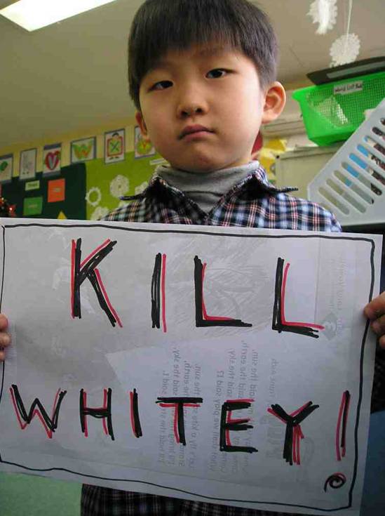 Asian kid holding "Kill Whitey" sign