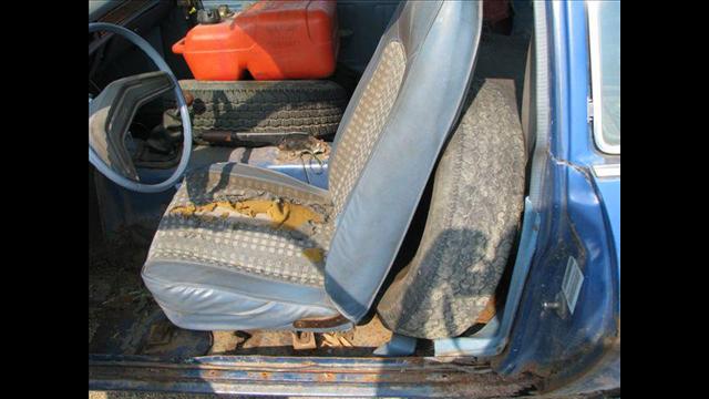 Driver's seat held erect by another spare tire
