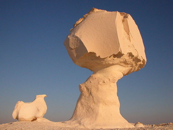 This limestone rock formation in Egypt's White Desert is not a true balancing rock. Usually found in desert areas, these so-called mushroom rocks, also known as pedestal rocks, form over thousands of years when wind erosion of an isolated rocky outcrop progresses at a different rate at its bottom than its top.