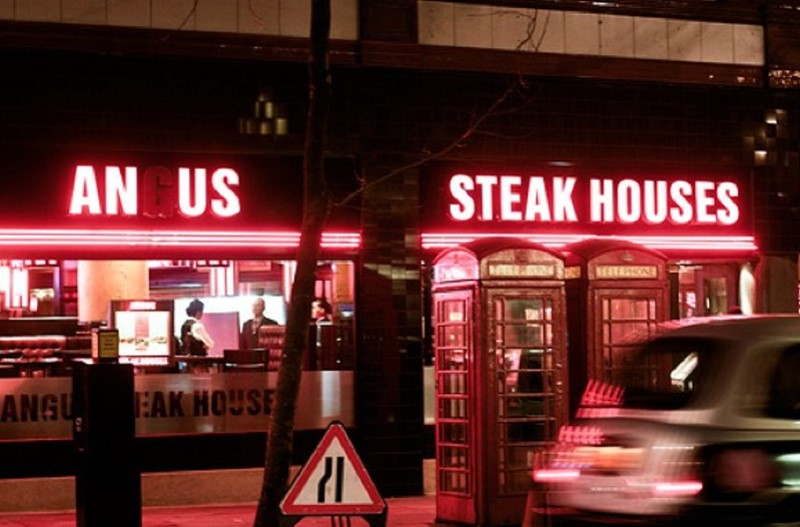 broken restaurant sign - An Us Steak Houses Ngu. Fak House