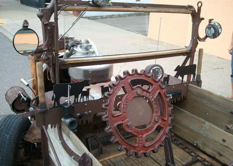 Check out the "gearing wheel".... What do you see? The dash is a saw blade with handles attached. Tractor hand brake. 2 mirrors mounted on horse shoes. Big truck signal switch mounted on left. Single wiper motor.