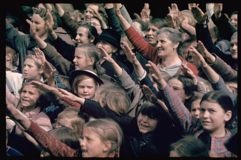 Austrians cheer Adolf Hitler during his 1938 campaign (before the Anschluss) to unite Austria and Germany
