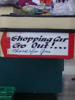 Sign at the checkout line at an asian market