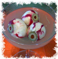 This is done with carved radishes stuffed with olives. Easy to do and can be added to various drinks.