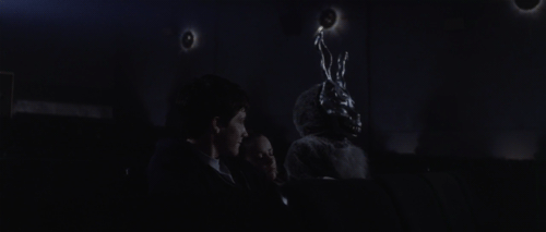 17.Donnie Darko: Someone at the house party jumps on a trampoline, wearing a Ronald Reagan mask. This is taken from a photo of Hunter S. Thompson doing the same.
