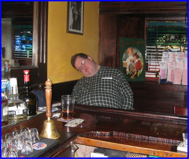 Peter Griffin passed out at the bar.