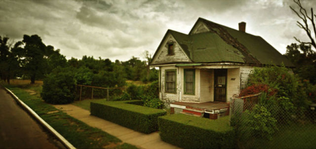 Interesting Google street view shows a house in stages of decay but with manicured front bushes.