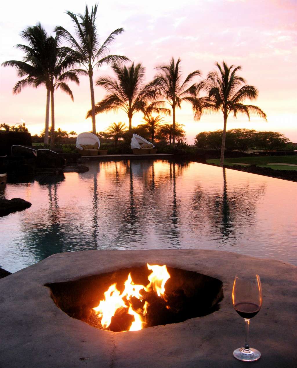 "Four Seasons Resort Hualalai." pool is made of rock and features an aquarium. It holds 1.8 million gallons of water.