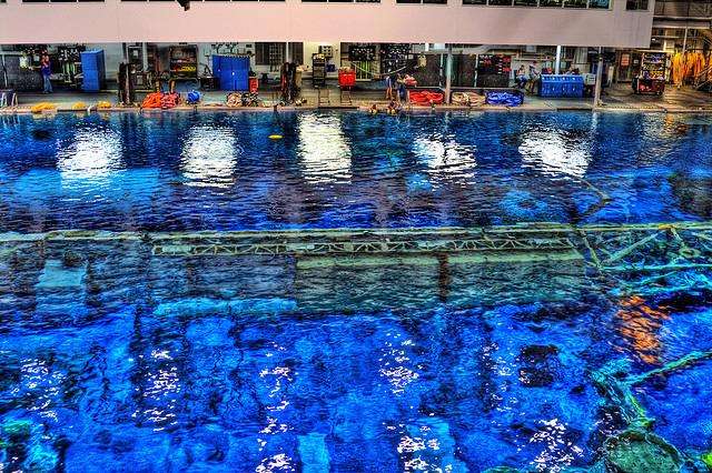 "Neutral Buoyancy Laboratory." NASA pool in Houston is 202 feet long, 102 feet wide, 40 feet 6 inches deep, and holds 6.2 million gallons of water.