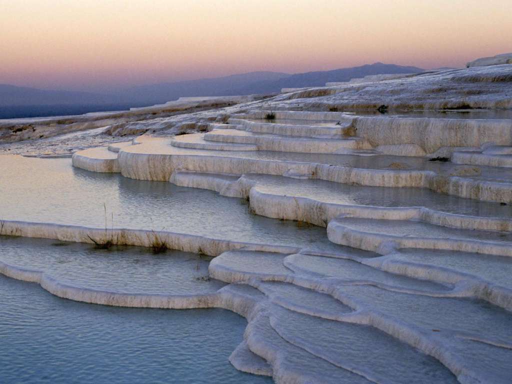"Pamukkale Pools." A natural hot springs in Turkey contain 17 pools that span the ruins of a former city.
