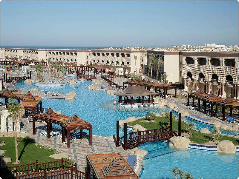 "SENTIDO Mamlouk Palace Resort." This huge Egyptian pool sits next to 400 meters of beachfront.