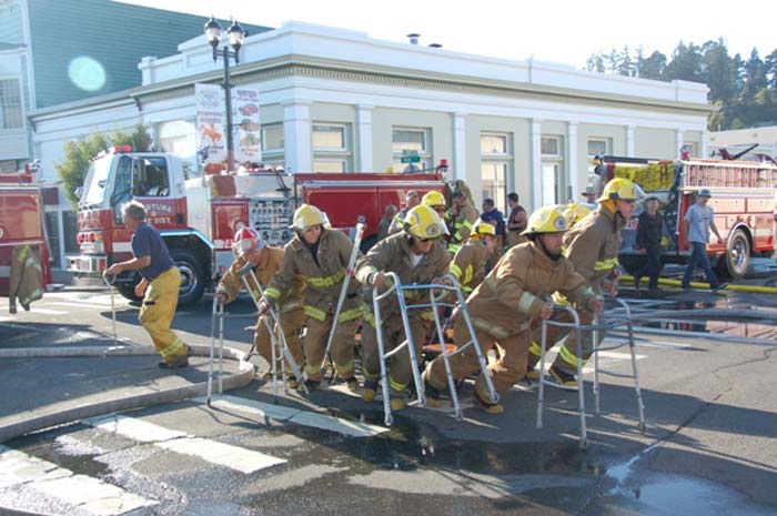 In a fire department full of men limited to walkers, the man with the cane is King... odd part is he's "running" in the wrong direction.