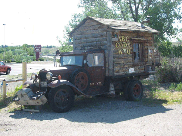  The guy who converted the Model T didn't corner the market on wooden campers, though. Check out this truck-slash-log cabin. It doesn't look like it's going anywhere soon, but it's nice to know that whereever you're parked, you've got a window to throw trash out of and a tiny stove for cookin' up some grits. 