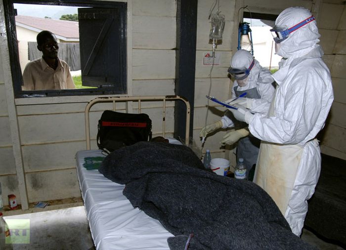 Staff attend an Ebola patient inside an isolation ward in Bundibugyo