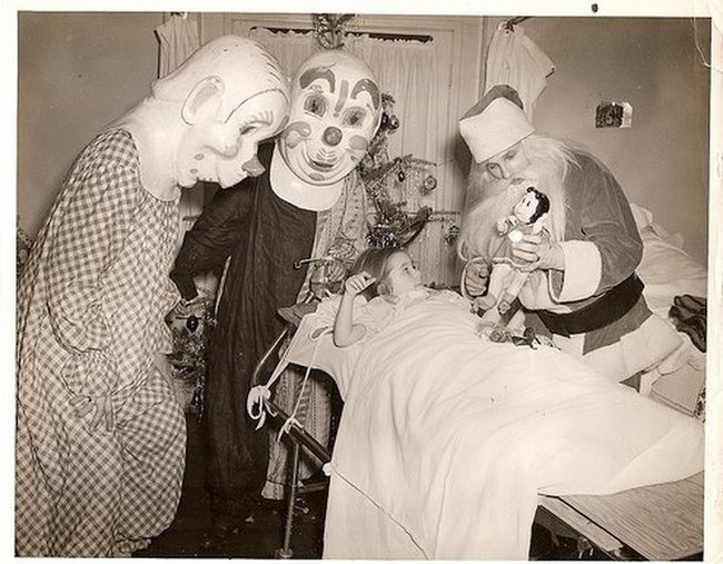 Two clowns and Santa visit a girl in hospital.