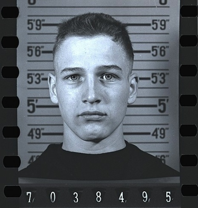 Paul Newman, 18, having his mugshot taken while joining the Navy. [1943]