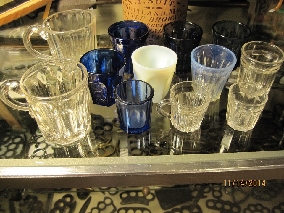 These are some of the first shot glasses made in America during the early to mid 1800's. They were hand blown into a mold and have rough bottoms. They're worth anywhere from 20 to 150 each and if you're lucky you can find them at yard sales for .50 cents!