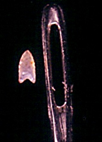 This Native American style spear point was chipped from stone under a microscope and can fit through the eye of a needle. 