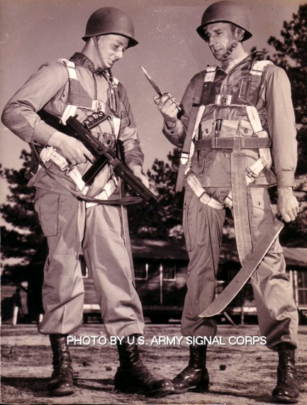 I was told this is a father and son in the 506th parachute infantry regiment during WWII. They are both armed with machetes, Thompson Submachine guns with 20 round clips, and my favorite knife ever the U.S.1918 Mark 1 brass knuckle trench knife.