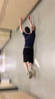 gifs - boy slides across a school hallway