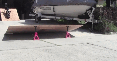 gifs - dog skateboarding on homemade ramp