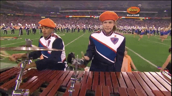 gifs - woman plays an instrument with no enthusiasm