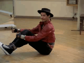 gifs - man moves across the floor while sitting