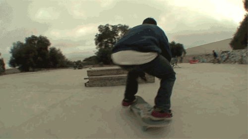 gifs - guy skateboards over obstacles